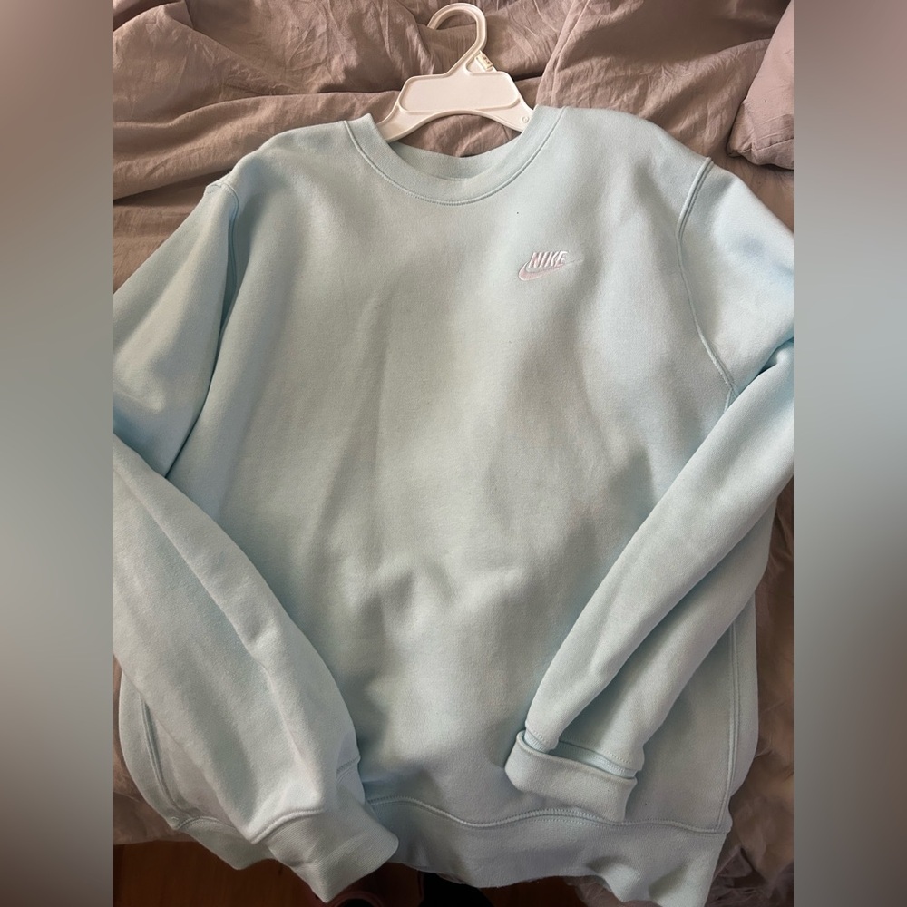 Light blue crew neck. Size small